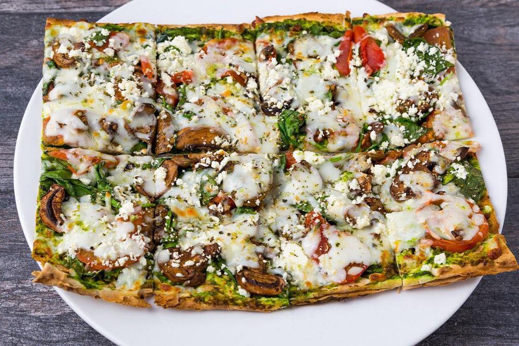 Spinach & Pesto Lavash Pizza · spinach, roasted mushrooms, wood-fired tomatoes, pesto, herbs, mozzarella, feta, thin lavash crust