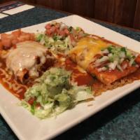Carne Asada Burrito · Muy grande flour tortilla stuffed with with skirt steak, beans, and rice. Smothered in El Pa...