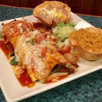 Burrito Manadero · Flour tortilla stuffed with steak, shrimp, rice, beans, grilled green peppers, and onions. G...