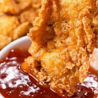 Chicken Fritters And Fries Or Onion Rings · Deep fried battered chicken breast fritters.