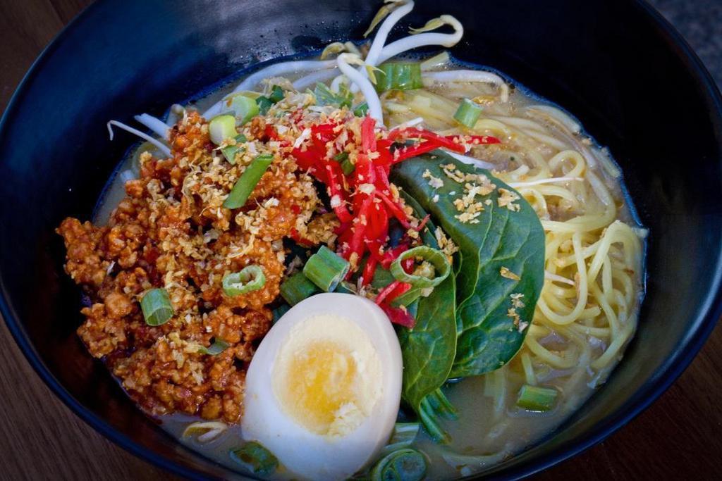 Tantan Men · Spicy ground pork, bean sprouts, spinach, scallions & soft boiled half egg in spicy miso broth over ramen