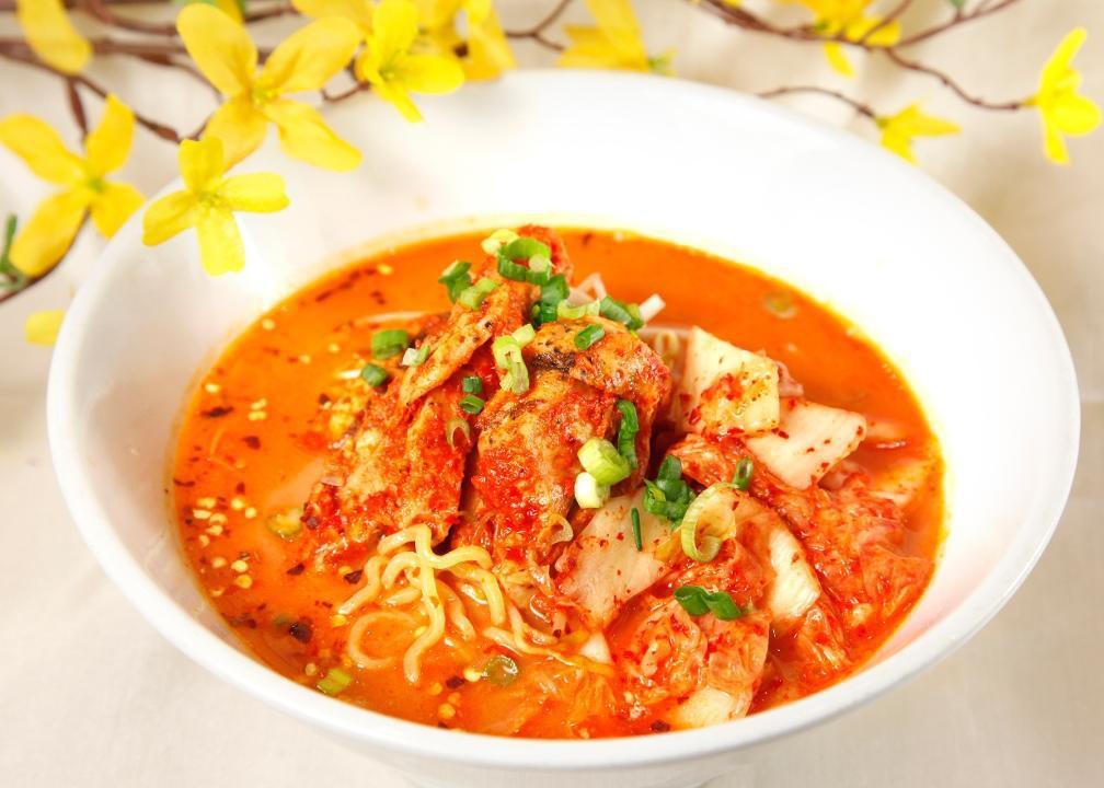 Kim Chi Ramen · Kimchi, Spicy chicken, bean sprouts, spinach, scallions & soft boiled half egg in spicy miso broth over ramen