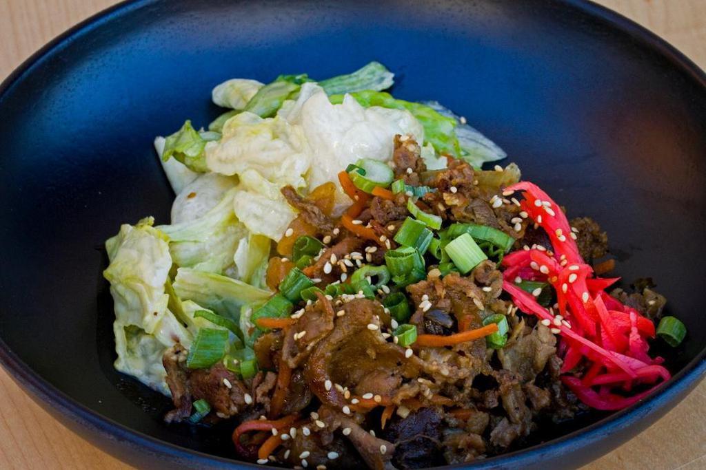 Bulgogi Bowl · Marinated sliced beef sautéed over steamed rice