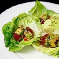 Poke Wrap · Poke tuna and avocado in lettuce wrap topped with shoe classic sauce and bell peppers