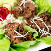 Bulgogi Wrap · Thin marinated beef in lettuce wrap topped with bell pepper and sesame seeds