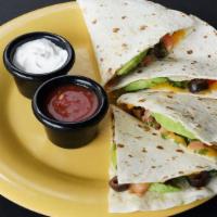 Deluxe Quesadilla · Cheddar Cheese · Diced Tomatoes · Olives · Sliced Avocado · Cilantro · Served with fresh mil...