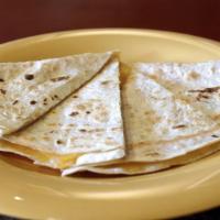 Kid Quesadilla · White or Whole Wheat Tortilla · Cheddar Cheese · Does not include salsa and sour cream.