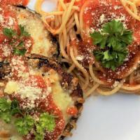 Eggplant Parmesan With Spaghetti Marinara · Thick cut Eggplant seasoned and breaded, then browned and topped with Mozzarella Cheese and ...
