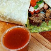 Carne Asada Burrito · CARNE ASADA BURRITO - (Tender 100% beef steak, Cesar’s guacamole fresh from avocado, and fre...