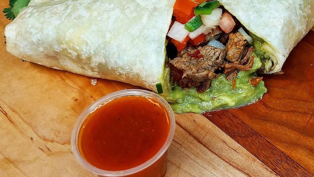 Carne Asada Burrito · CARNE ASADA BURRITO - (Tender 100% beef steak, Cesar’s guacamole fresh from avocado, and fresh pico de gallo)