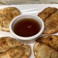 Pan Fried Dumplings · Cabbage, carrot, celery, ginger, and minced veg protein filling tucked into each dumpling. E...