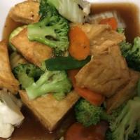 Love Of Family · Golden tofu stir-fried with broccoli, carrot, cauliflower, napa cabbage, snow peas, and zucc...
