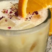 Orange Sunshine  · Orange juice, organic soy milk, garnished with flower petals.