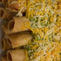 12 Rolled Tacos · w/ cheese & guacamole.