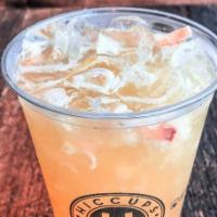 Lychee Sweet Tea  · Lychee green tea with lychee bits, hand-shaken and served with ice.