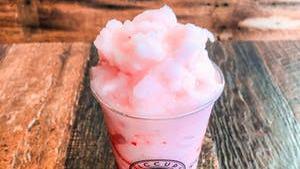 Lychee Breeze  · Strawberry and lychee flavored slushie served with strawberry bits.