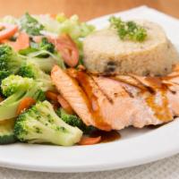 Grilled Teriyaki Salmon · Grilled Teriyaki Sockeye Salmon Fillets Served Over Rice Pilaf with Mixed Vegetables & Salad.