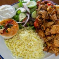 Chicken Shawarma Plate · Grilled chicken breast, onions, tomatoes served with rice, hummus, pita bread, side of house...