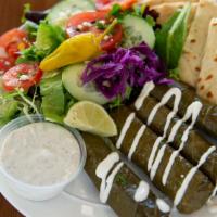 Meat Dolma Plate · Ground beef, rice, seasonings stuffed in grape leaves served with Greek salad, pita bread, s...