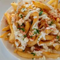Gyro Fries · large Greek fries topped with gyro meat,garlic souse and feta cheese