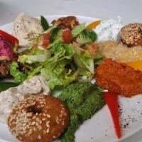 Mezza Plate · Three falafel pieces, side of tabouli, hummus, tzatziki.