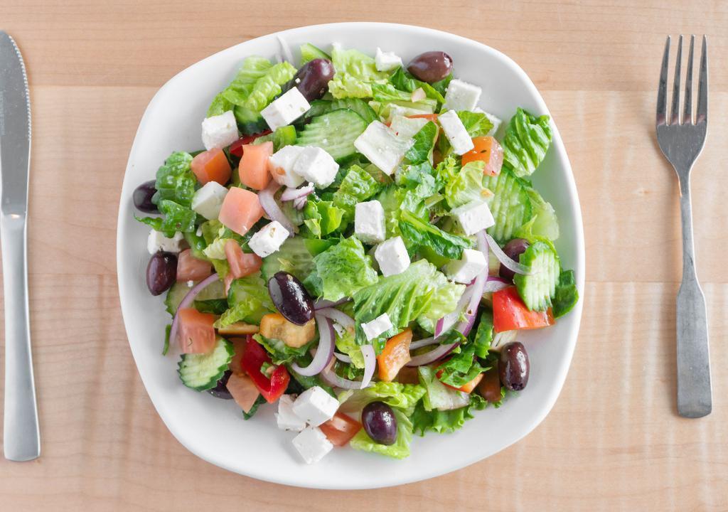 Greek Salad · Romaine lettuce, tomatoes, cucumbers, onions, greek olives, and feta cheese, served with a side of house dressing.