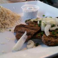 Gyro Classic Plate · Beef and lamb gyro on top of fluffy white rice, topped with onions and parsley, served with ...