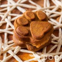 Pb Paw Cookie · Grain free flour, molasses, cinnamon, oil, and sandwiched with peanut butter.