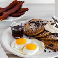 Chocolate Chip Pancakes · Chocolate chip buttermilk batter topped with chocolate chips and a sprinkle of powdered suga...