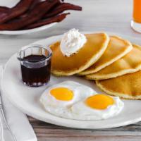 Buttermilk Pancakes · A classic! Light and fluffy from an aged sourdough buttermilk batter. Served with a side of ...