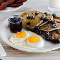 Blueberry Pancakes · Our aged buttermilk batter filled with fresh blueberries, topped with a sprinkle of powdered...