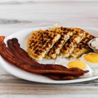 Bacon Waffle · Baked with our thick-cut bacon bits. Served with a side of maple syrup and whipped butter.