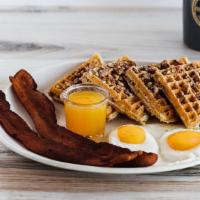 Georgia Pecan Waffle · Baked and topped with pecans. Served with a side of homemade tropical syrup and whipped butt...