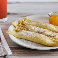 French Crepes · Three delicate crepes filled with strawberry preserves and dusted with powdered sugar.