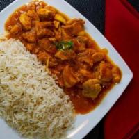 Chicken Qurma · Boneless chicken cooked with onions, garlic, ginger, tomatoes, and spices Served with rice.