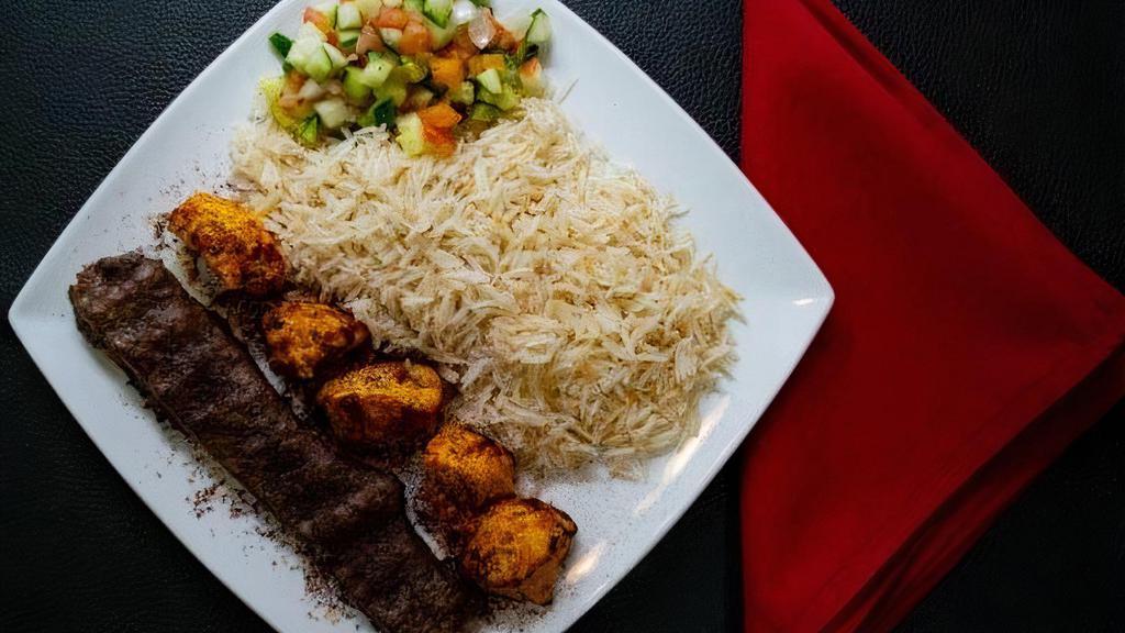 Mix Kabob · A skewer of chicken kabob and a skewer of ground beef kabob served with rice, and salad.