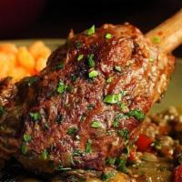 Lamb Shank Mughuli · Braised lamb shank simmered with ginger, garlic and roasted eggplant