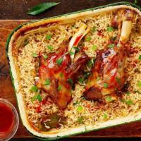 Lamb Shank Palow · Afghan style rice cooked with lamb, onions, garlic, ginger, and other spices served with egg...