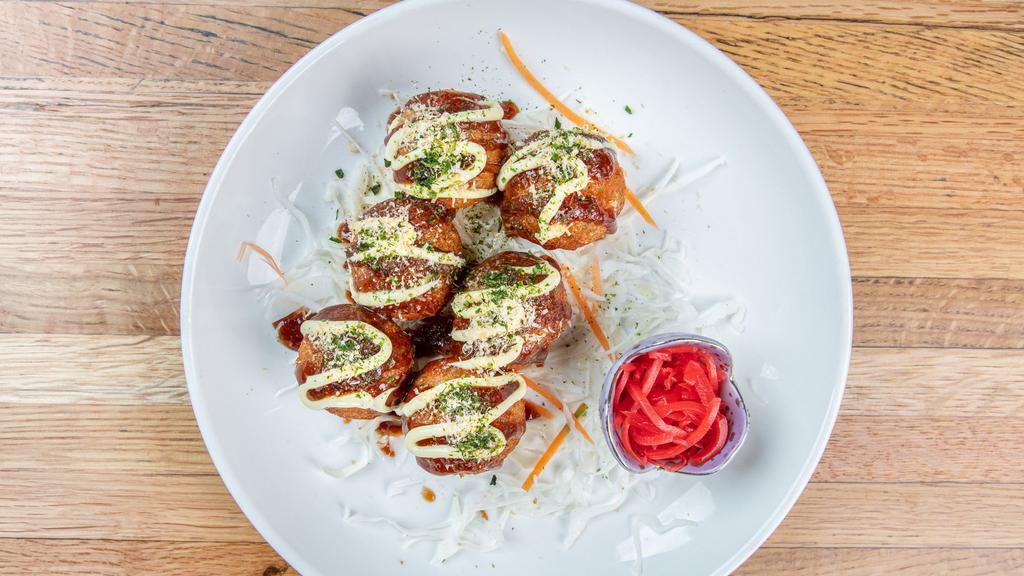 Takoyaki · Deep-fried octopus balls, topped with bonito flakes, pickled ginger, and seaweed flakes with okonomiyaki sauce (6 pcs).