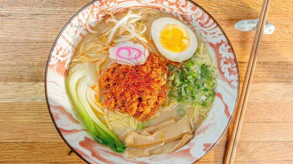 Spicy Tantanmen Ramen · Spicy. Creamy pork broth, spicy garlic ground pork, egg, bok choy, bean sprouts, bamboo, green onions, fried onions, fishcake and red pepper strips.