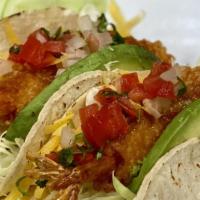 Baja Shrimp Taco    · Beer battered shrimp served on a tortilla with mixed cabbage. Topped with pico de gallo, and...