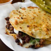 Mulita · 2 handmade corn tortillas with melted jack cheese stuffed with your choice of meat or vegeta...