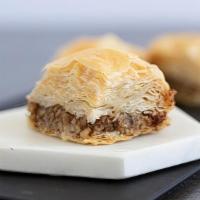 Walnut Baklava · crunchy layers of phyllo, generous walnut & cashew filling. syrup contains honey and orange ...