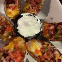 Potato Skins · Topped with melted mixed cheddar jack cheese, bacon bits, pico de gallo, served with sour cr...