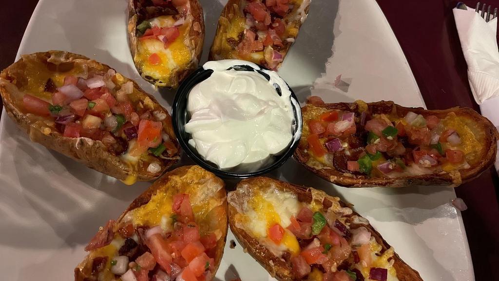 Potato Skins · Topped with melted mixed cheddar jack cheese, bacon bits, pico de gallo, served with sour cream.