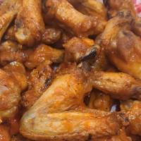 Buffalo Wings (16Pc) · Our buffalo style wings are tossed in any our signature sauces. (choose up to two sauces).