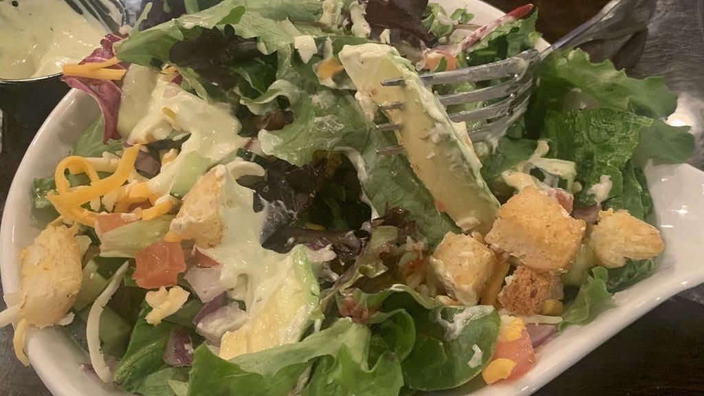Caesar Salad · Crisp romaine lettuce tossed with shaved Parmesan and garlic croutons.