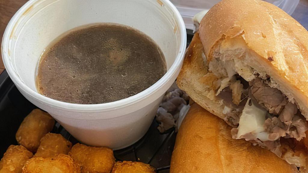French Dip · Thinly sliced prime rib beef, Mozzarella, hoagie roll, au jus. Served with your choice of one side.