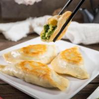 Pan Fried Chive Dumplings (3) · Traditional dumplings filled with chives and pan-fried to create crispiness.