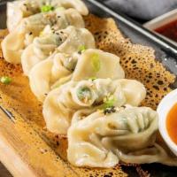Fried Wonton With  Spicy Garlic Sauce (6) · Hand-made fried wontons with a chicken & vegetable filling and a spicy garlic sauce on the s...